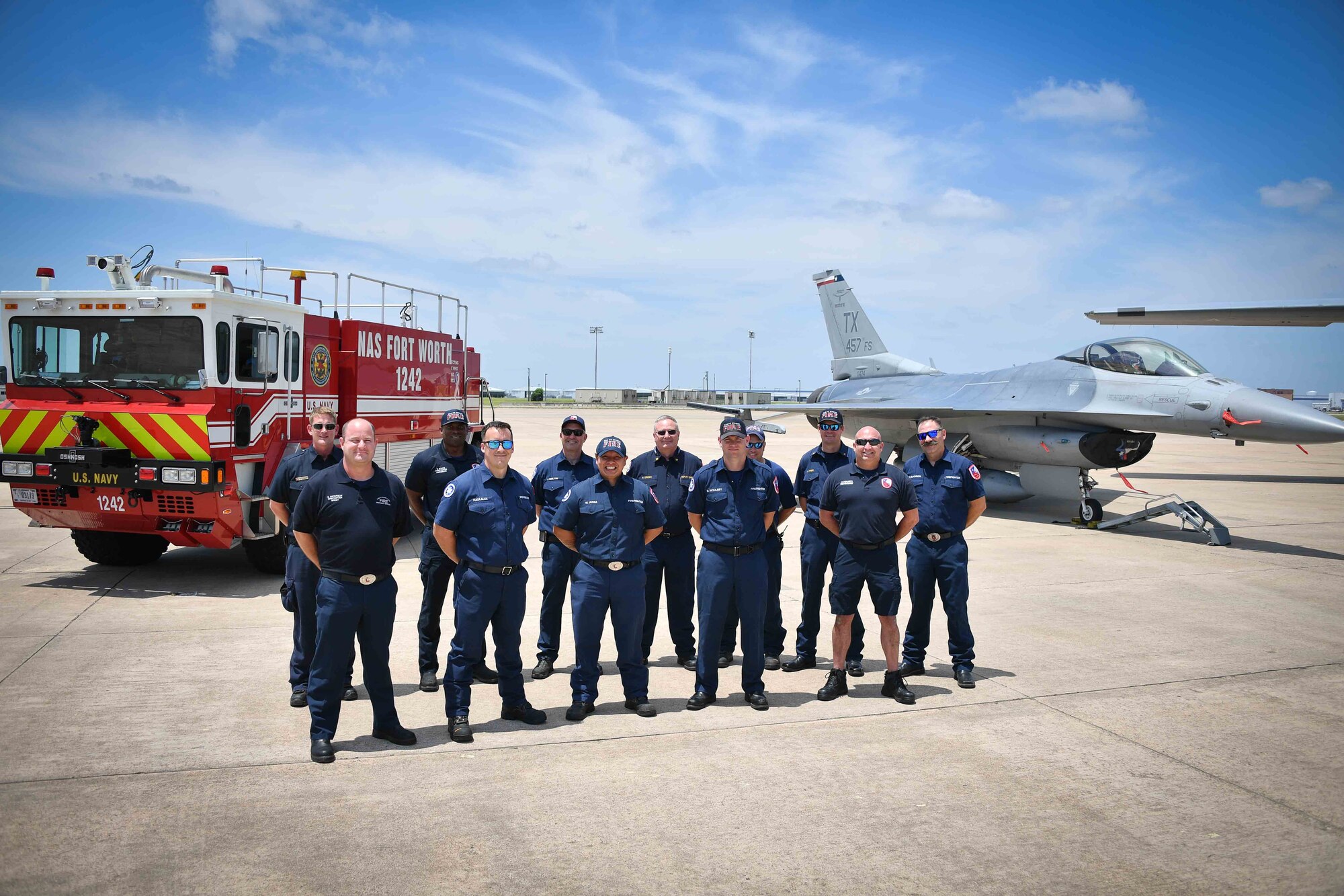 Several members of the Naval Air Station Fort Worth Fire and Emergency Services Department stand ready to serve. Their core values are integrity, honor and legacy. This pledge is to serve their fellow firefighter and those who need their help today, to honor their past and to entrust what they are doing now to future firefighters. (U.S. Air Force photo by Staff Sgt. Randall Moose)