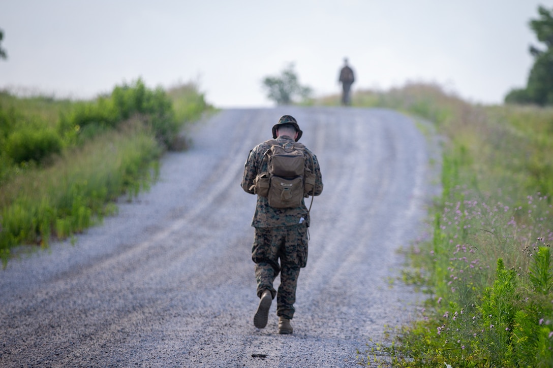 U.S. Marine Corps Capt. Mason Weber, an infantry officer with 2d Marine Division (MARDIV), participates in a land navigation course as part of the Division Leader Assessment Program (DLAP) at Fort Pickett, Va., June 21, 2021. DLAP assesses the preparedness of 2d MARDIV's newly-assigned infantry Captains by evaluating their mental, moral, and physical readiness for infantry company command, ensuring the Division places the right leaders in front of the right companies at the right time. DLAP is a key component in the Division's mission to train and certify units that demonstrate apex levels of lethality, endurance and comprehensive warfighting ability to be employed by their gaining higher headquarters immediately upon deployment. (U.S. Marine Corps photo by Lance Cpl. Brian Bolin Jr.)