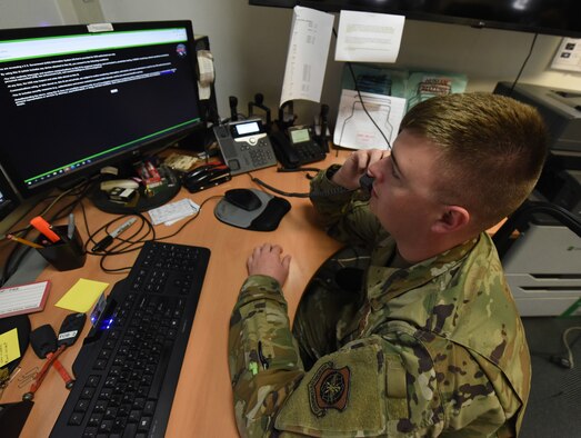Staff Sgt. William Plate, a 721st Aerial Port Squadron special handling supervisor, takes a call at the 721st APS special handling office dispatch desk at Ramstein Air Base, Germany, June 18, 2021. Plate and others members of the special handling flight coordinate a large volume of cargo loading missions at Ramstein and to ensure it gets where it needs to be worldwide. (U.S. Air Force photo by Senior Airman Thomas Karol)