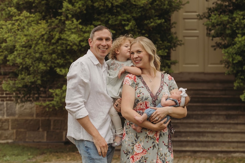 U.S. Air Force Lt. Col. Brian Campbell, 633rd Logistics Readiness Squadron commander, and his wife Kat Campbell, pose for a photo with their daughters, Alexandra and Olivia. The couple now balances active duty military life and raising a young family. (Courtesy photo)