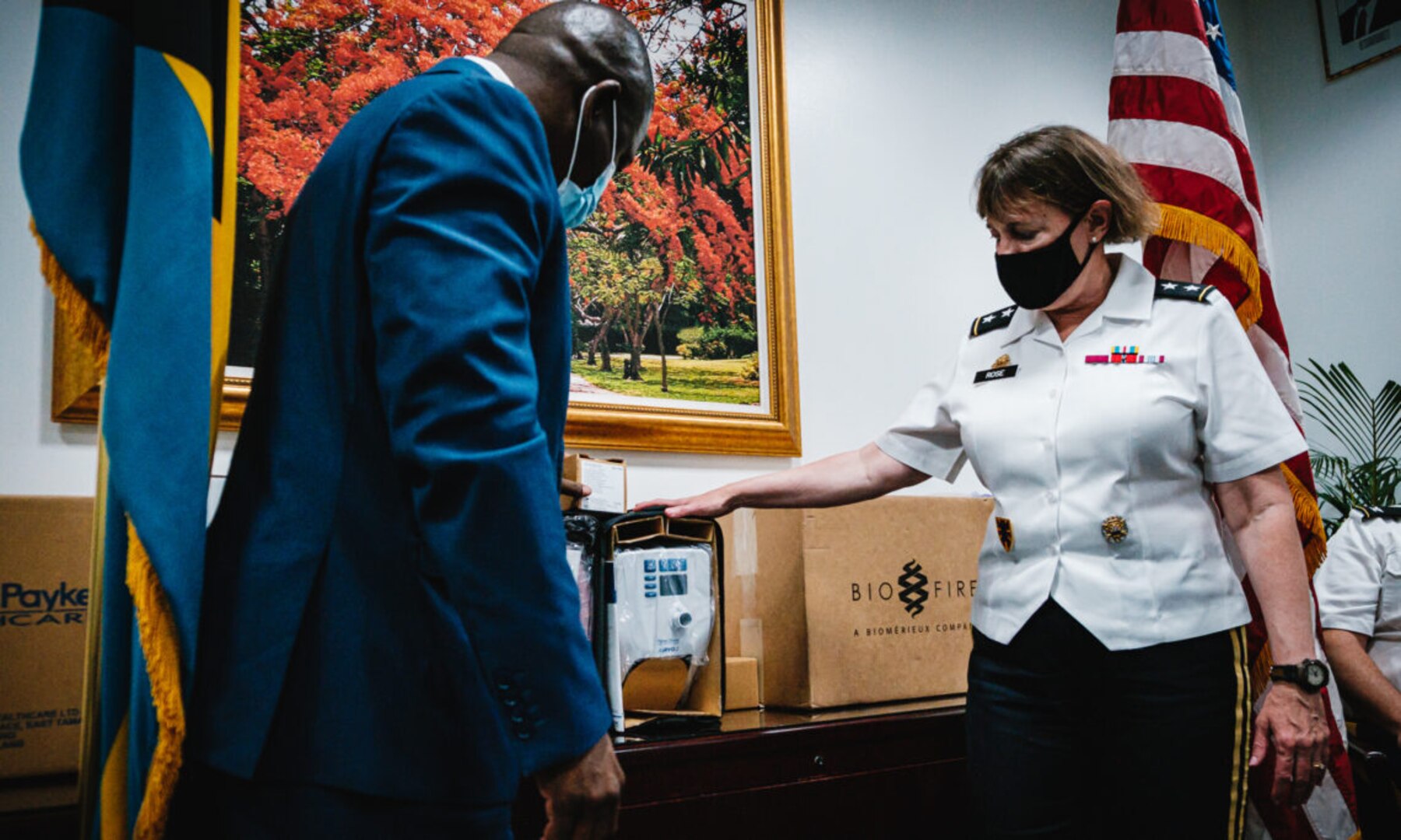 Maj. Gen. Michelle Rose of U.S. Northern Command demonstrates one of 20 total AIRVO respirators being donated to the Bahamas Ministry of Health, to Minister of Health Renward Wells, June 23, 2021.