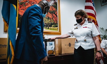 Maj. Gen. Michelle Rose of U.S. Northern Command demonstrates one of 20 total AIRVO respirators being donated to the Bahamas Ministry of Health, to Minister of Health Renward Wells, June 23, 2021.