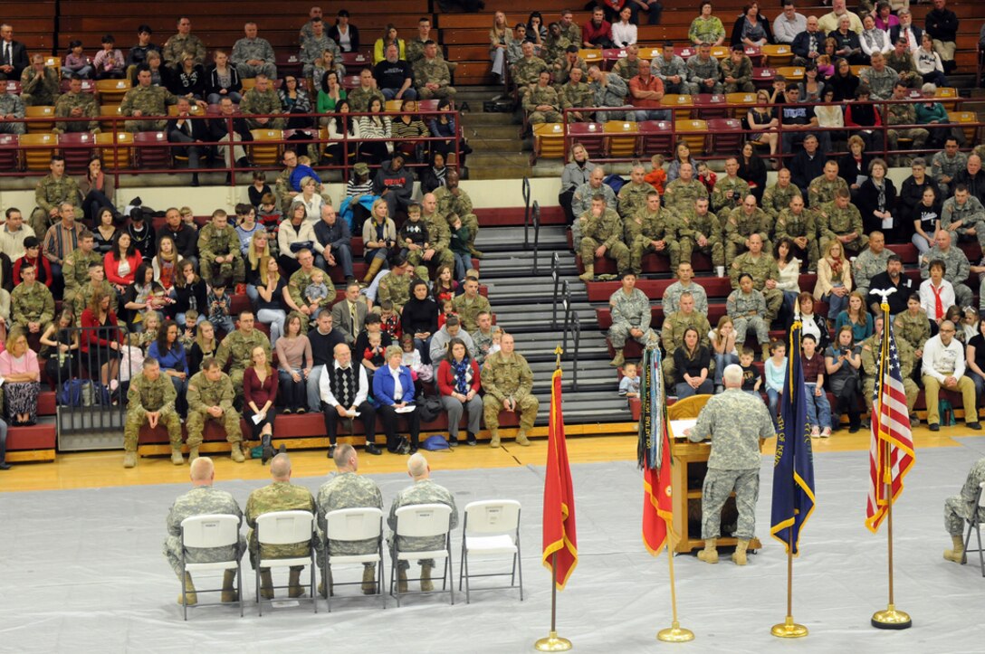 Soldiers sat with their families during the ceremony, part of the unit's "family is first" philosophy.
