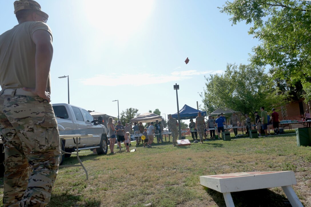 Airmen play cornhole