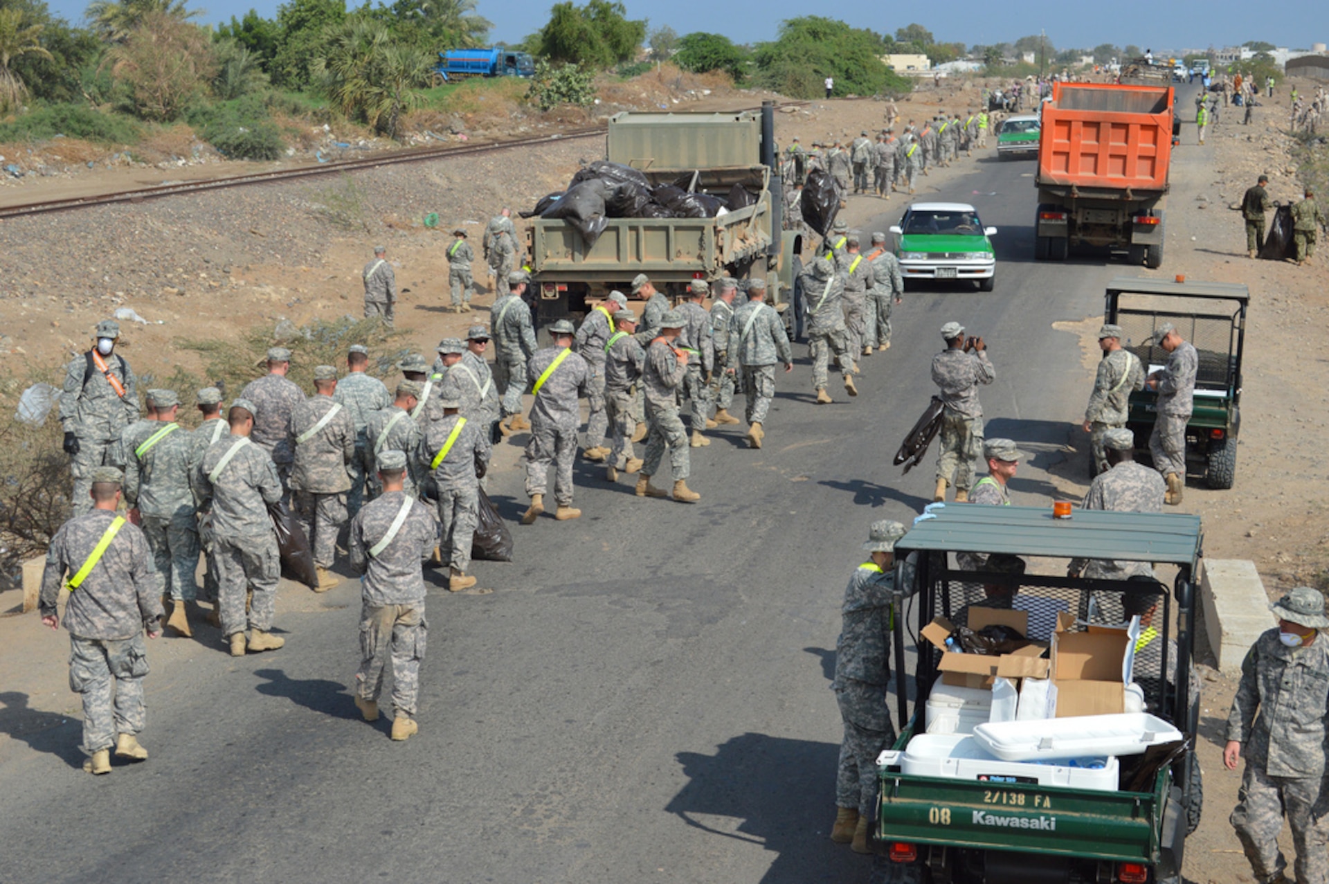 Two groups started at opposite ends of the road, cleaning up debris and trash, working throughout the day.