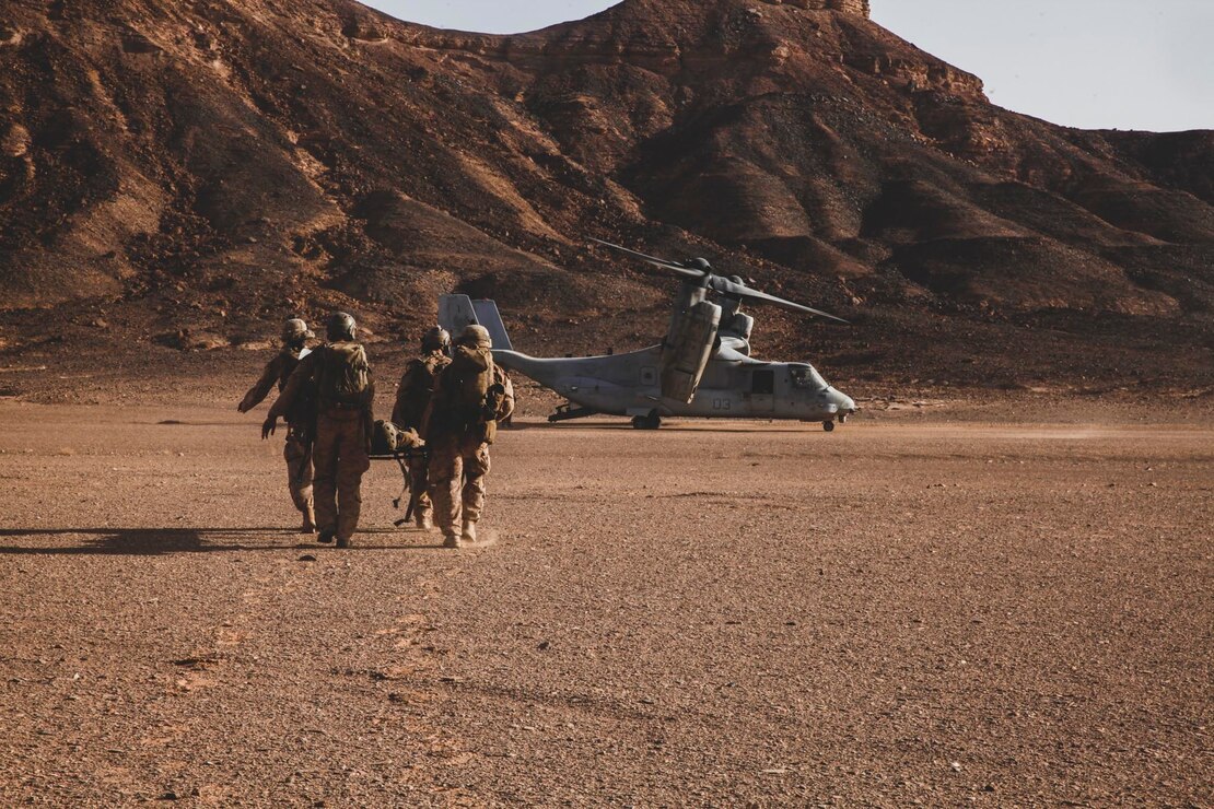 Marines assigned to the 24th Marine Expeditionary Unit carry a simulated casualty to an MV-22B Osprey tiltrotor aircraft during a quick reaction force drill as part of a theater amphibious combat rehearsal at Tabuk Training Center, Kingdom of Saudi Arabia, June 12. TACR integrates U.S. Navy and Marine Corps assets to exercise a range of critical combat-related capabilities, both afloat and ashore. 24th MEU is deployed to the U.S. 5th Fleet area of operations in support of naval operations to ensure maritime stability and security in the Central Region, connecting the Mediterranean and Pacific through the western Indian Ocean and three strategic choke points.