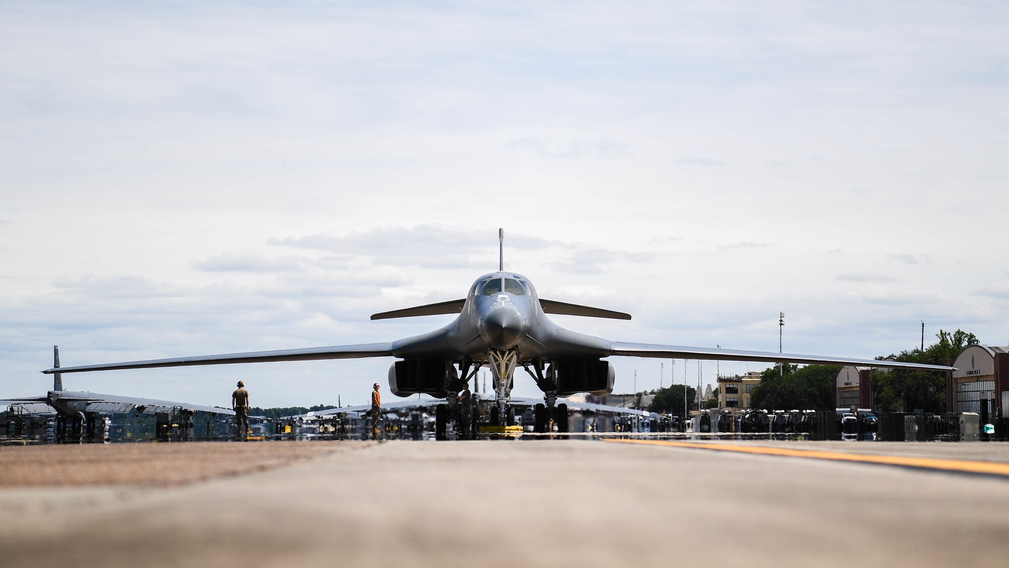 A B-1B Lancer from Dyess Air Force Base, Texas, parks on the flight line at Barksdale Air Force Base, Louisiana, June 22, 2021. The aircraft was flown to Barksdale to become decommissioned and displayed as a part of Barksdale's Global Power Museum airpark of static displays. (U.S. Air Force photo by Senior Airman Jacob B. Wrightsman)