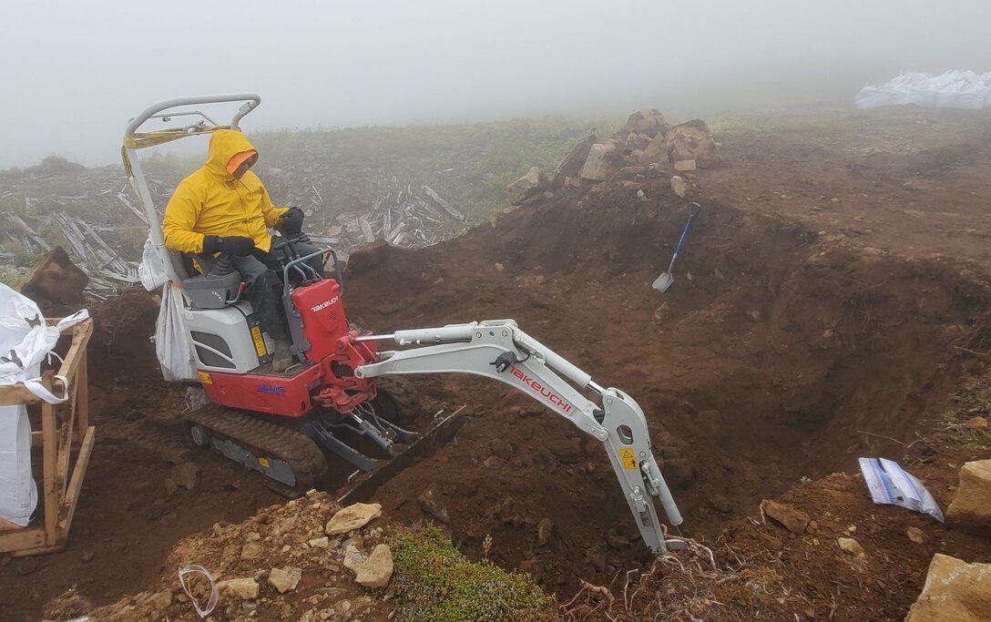 A crew member excavates contaminated soil at the Cape Prominence Formerly Used Defense Site for the U.S. Army Corps of Engineers – Alaska District.