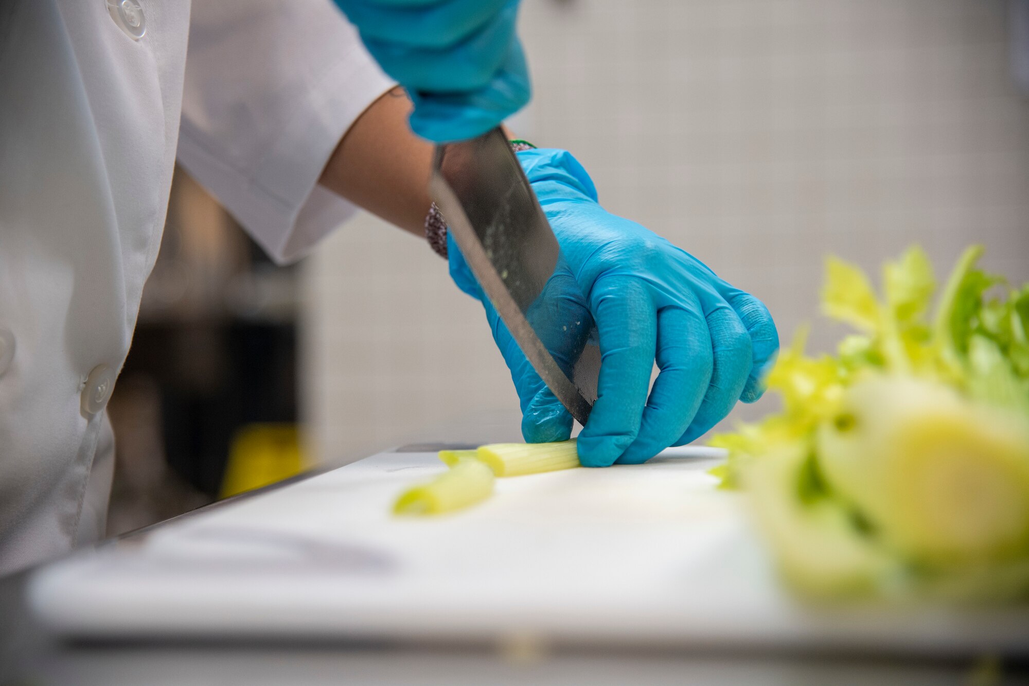 U.S. Air Force Senior Airman Haley Garces, 6th Force Support Squadron food services journeyman, prepares food for service members at MacDill Air Force Base, Florida, June 15, 2021.