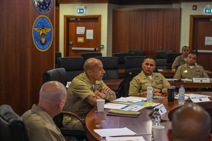 (June 15, 2021) U.S. Naval Forces Europe-Africa Fleet Master Chief Derrick Walters, center, and Command Master Chief Johannes Gonzalez, U.S. Sixth Fleet Command Master Chief, center right, address attendees at a Command Senior Enlisted Symposium at Naval Support Activity Naples, Italy, June 15, 2021. U.S. Naval Forces Europe-Africa, headquartered in Naples, Italy, Conducts the full spectrum of joint and naval operations, often in concert with allied and interagency partners in order to advance U.S. national interests and security and stability in Europe and Africa. (U.S. Navy Photo by Mass Communication Specialist 2nd Class Trey Fowler/Released)