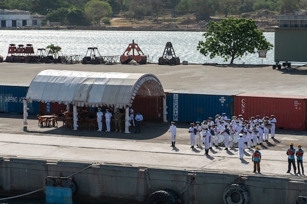 TRINCOMALEE, Sri Lanka (June 23, 2021) The Sri Lankan Navy band provides a welcoming ceremony to Independence-variant littoral combat ship USS Charleston (LCS 18) during the ship's arrival ahead of Cooperation Afloat and Readiness at Sea Training (CARAT) Sri Lanka, June 23. In its 27th year, the CARAT series is comprised of multinational exercises, designed to enhance U.S. and partner navies’ abilities to operate together in response to traditional and non-traditional maritime security challenges in the Indo-Pacific region.