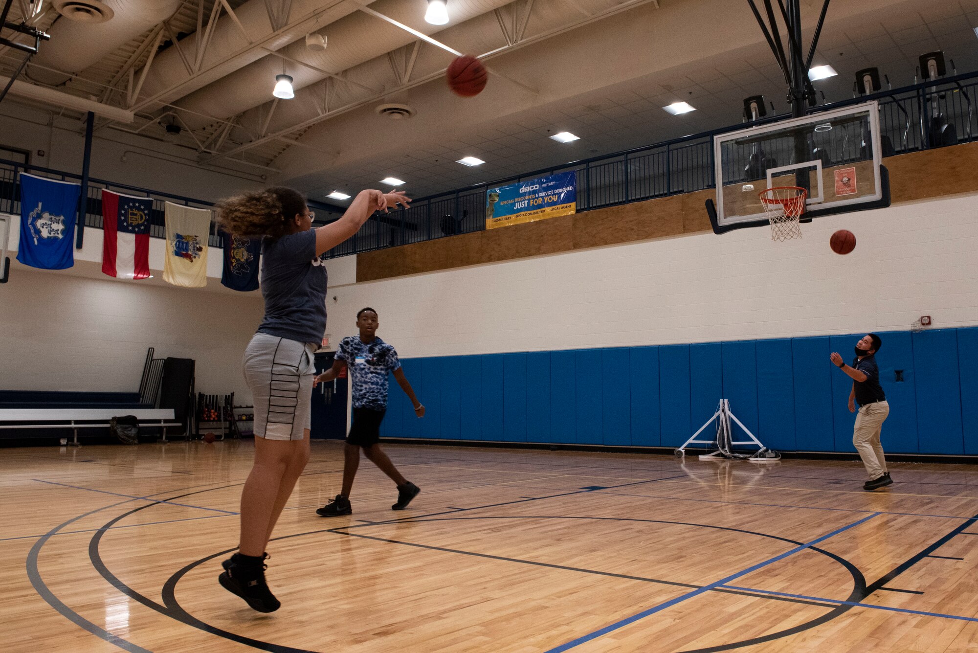 A photo of a teen playing basketball.