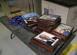 A framed photograph of President Joseph R. Biden Jr., sits with other photos that hung in the now-closed Camp As Sayliyah-Main, Qatar, dining facility, where June 10, 2021 the last meals were served. Although, there was an evening meal, the highlight of the day was the lunch dedicated to the Army's June 14 birthday. The Army birthday lunch featured Area Support Group-Qatar's last command team, ASG-Qatar Commander Col. Stephen A. Fabiano and his senior enlisted advisor Command Sgt. Maj. Jose Hernandez cutting an Army birthday cake, a carving station, two ice sculptures and carved fruit displays.