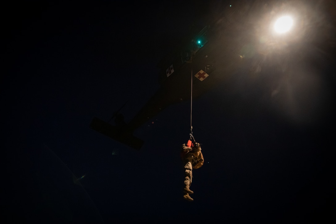 Army Reserve medevac company teaches military working dog handlers hoist procedures