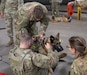 Flight medics and crew chiefs in Company C, 7th Battalion, 158th Aviation Regiment, 11th Expeditionary Combat Aviation Brigade, conducts Medevac hoist training with military working dog handlers in the 69th Military Police Detachment on Fort Carson, Colorado, June 2, 2021. This training ensures that K-9 handlers are familiar with safely rigging their MWDs to the hoist mechanism for Medevac extraction.