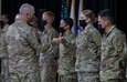 U.S. Army Command Sgt. Maj Brian Hester (left), the senior enlisted advisor to U.S. Army Central, fist bumps U.S. Army Spc. Rena Bailey, a wheeled vehicle mechanic with Area Support Group – Kuwait, during the recognition ceremony for the U.S. Army Central 2021 Best Warrior Competition at Camp Arifjan, Kuwait, June 24, 2021. A total of 11 competitors took part, from various places in the United States, as well as representing the Army, Army Reserve, and National Guard. (U.S. Army photo by Spc. Maximilian Huth, U.S. Army Central Public Affairs)