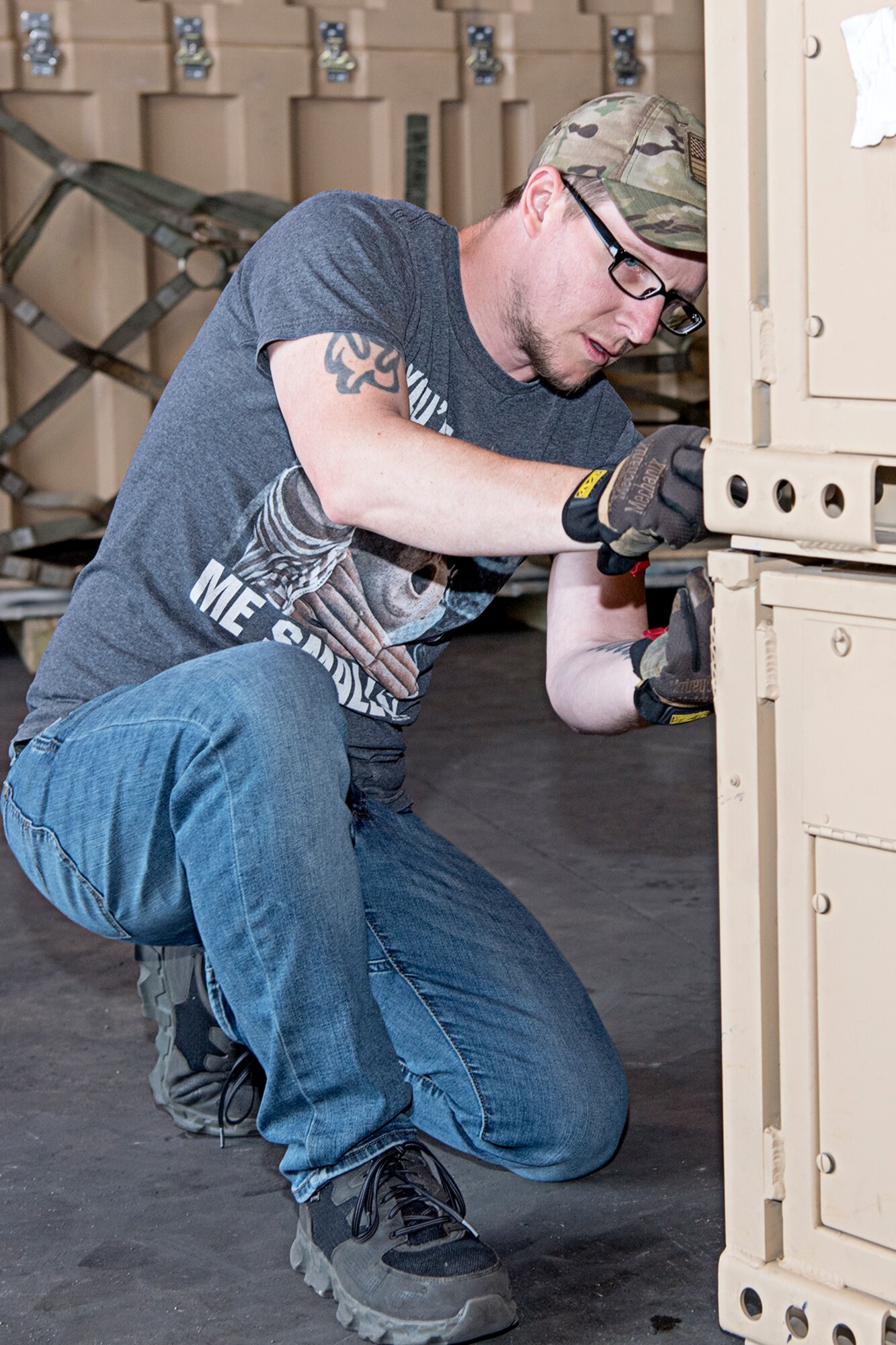 Ryan Sautter, warehouse lead for the Air Force Reserve Command's contingency equipment management facility at Grissom, prepares a generator for palletization and shipment to Hawaii for an joint service exercise called Pacific Warriorz. Grissom's CEMF supports dozens of units supplying civil engineers with the equipment they need to perform missions around the world.  (U.S. Air Force photo/Douglas Hays)