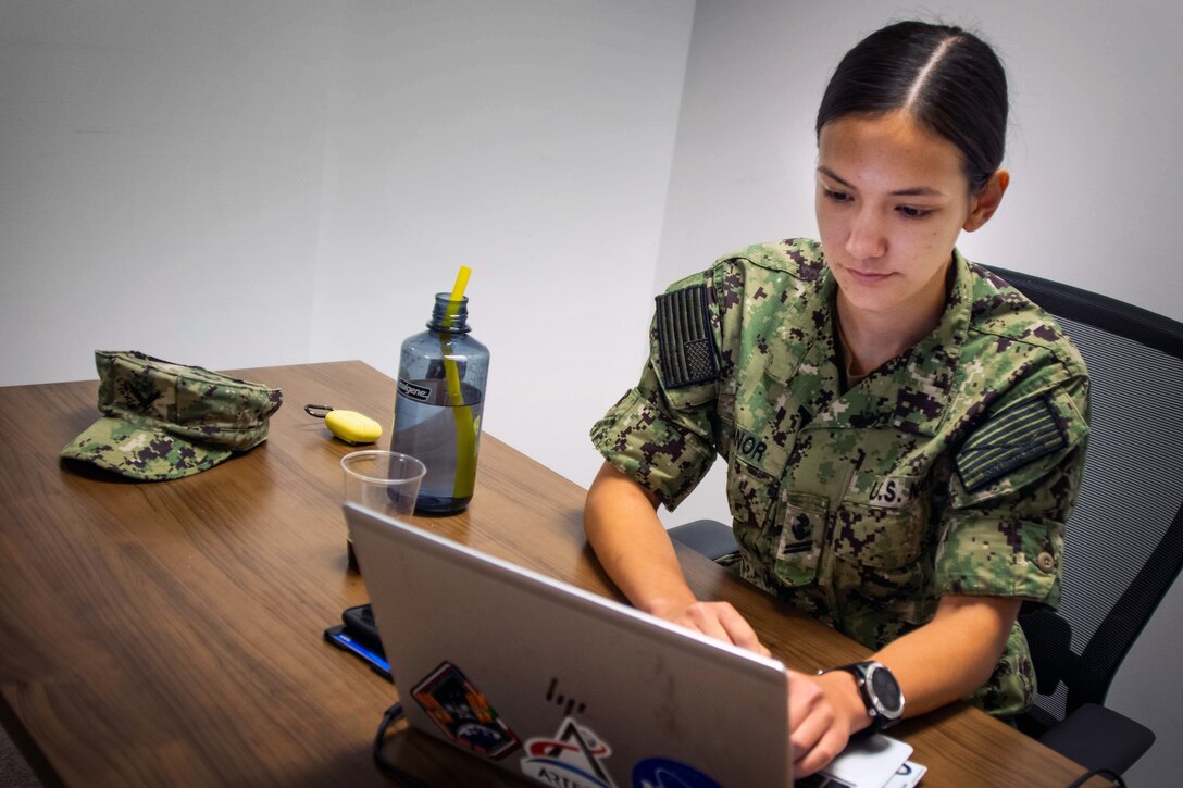 Navy Midshipman 2nd Class Veronica O’Connor, a red team operator with U.S. Cyber Command, works to weaken adversary networks in a virtual training environment during the Cyber Flag 21-2 exercise, June 22, 2021.
