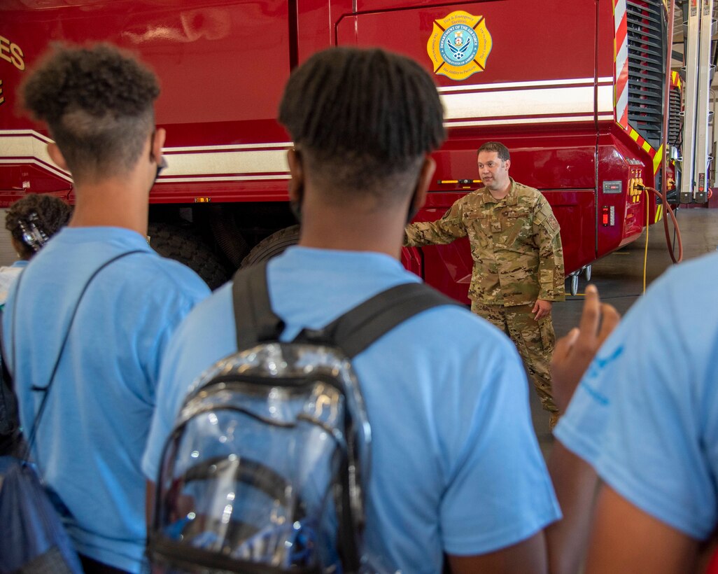 Tech. Sgt. Scott Morisette, 436th Civil Engineer Squadron firefighter, briefs members of the Organization for Black Aerospace Professionals during a tour of Dover Air Force Base, Delaware, June 23, 2021. OBAP is a nonprofit organization dedicated to the encouragement and advancement of minorities in all aviation and aerospace careers. (U.S. Air Force photo by Tech. Sgt. Nicole Leidholm)