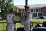 IMAGE: Executive Officer of Naval Surface Warfare Center Dahlgren Division (NSWCDD) Lt. Cmdr. David ‘Dave’ Rackley is presented a medal for Meritorious Service from NSWCDD Commanding Officer Capt. Stephen “Casey” Plew on June 18, 2021. (U.S. Navy/Released)