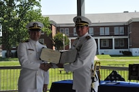 IMAGE: Executive Officer of Naval Surface Warfare Center Dahlgren Division (NSWCDD) Lt. Cmdr. David ‘Dave’ Rackley is presented a medal for Meritorious Service from NSWCDD Commanding Officer Capt. Stephen “Casey” Plew on June 18, 2021. (U.S. Navy/Released)