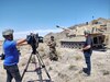 Reporters from KUTV 2 news interview Staff Sgt. Michael Jordan, section chief C Battery, 145th Field Artillery Battalion at Dugway Proving Grounds, Utah, June 12, 2021. The battalion was demonstrating fires capabilities during annual training for the media to observe. (U.S. Army photo by Capt. Jeffrey Dallin Belnap)
