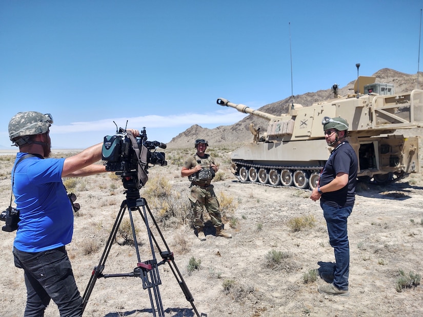 Reporters from KUTV 2 news interview Staff Sgt. Michael Jordan, section chief C Battery, 145th Field Artillery Battalion at Dugway Proving Grounds, Utah, June 12, 2021. The battalion was demonstrating fires capabilities during annual training for the media to observe