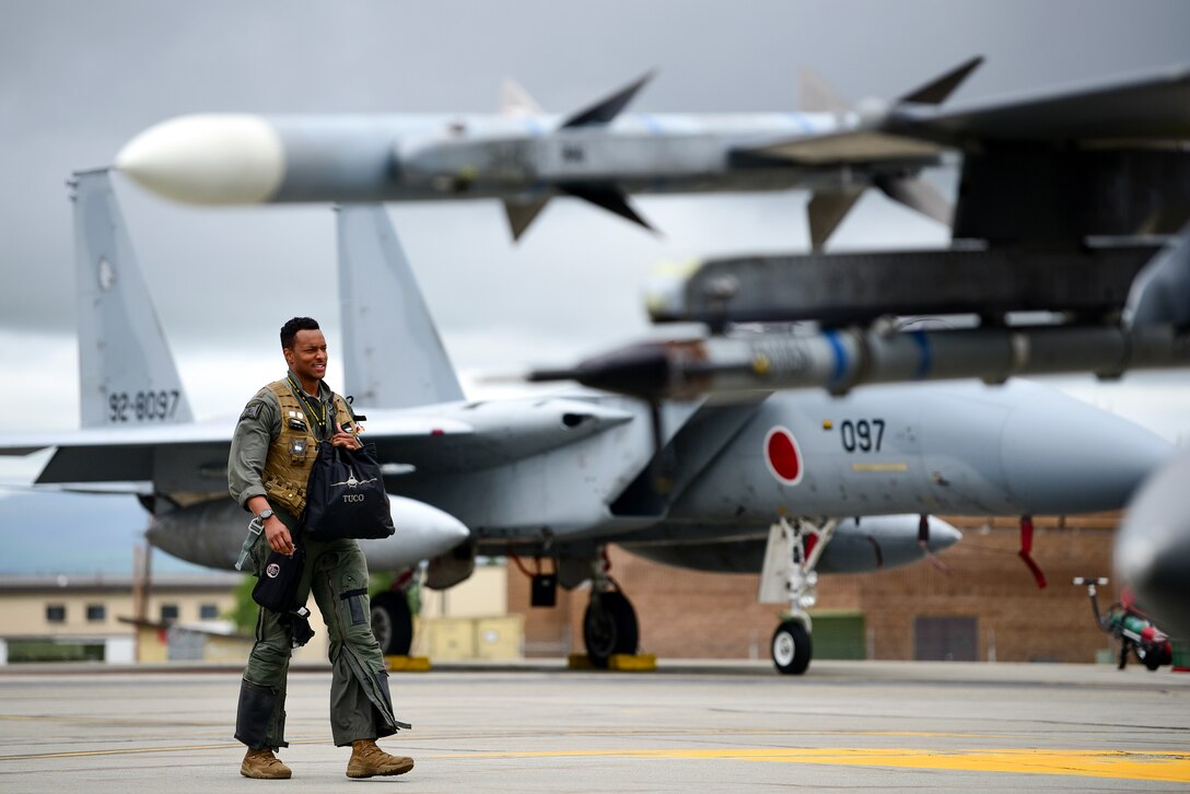 Maj. Chris “Tuco” Harrison, 80th Fighter Squadron assistant director of operations and chief of standards and evaluations, walks toward an F-16 Fighting Falcon assigned to Kunsan Air Base, Republic of Korea, during Red Flag-Alaska 21-2 at Eielson Air Force Base, Alaska, June 18, 2021. RF-A is a Pacific Air Forces-directed field training exercise designed to provide realistic air combat training for U.S. and allied forces. (U.S. Air Force photo by Senior Airman Suzie Plotnikov)