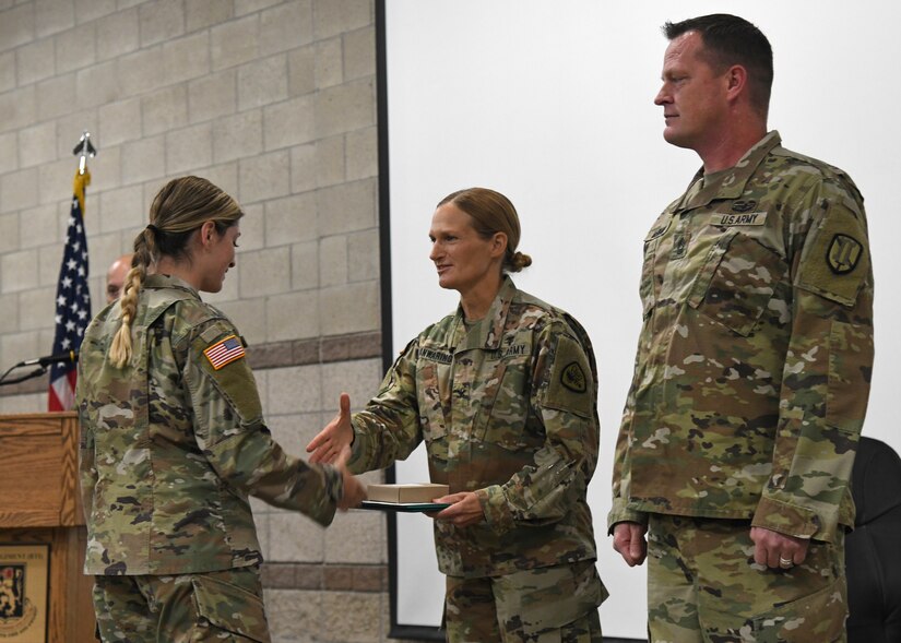 Soldiers from the Utah National Guard’s COVID-19 Task Force stand at attention while a military order is being read at a demobilization award ceremony at Camp Williams, Utah, June 16, 2021.