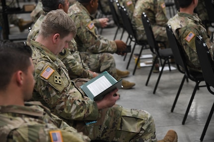 Soldiers from the Utah National Guard’s COVID-19 Task Force stand at attention while a military order is being read at a demobilization award ceremony at Camp Williams, Utah, June 16, 2021.
