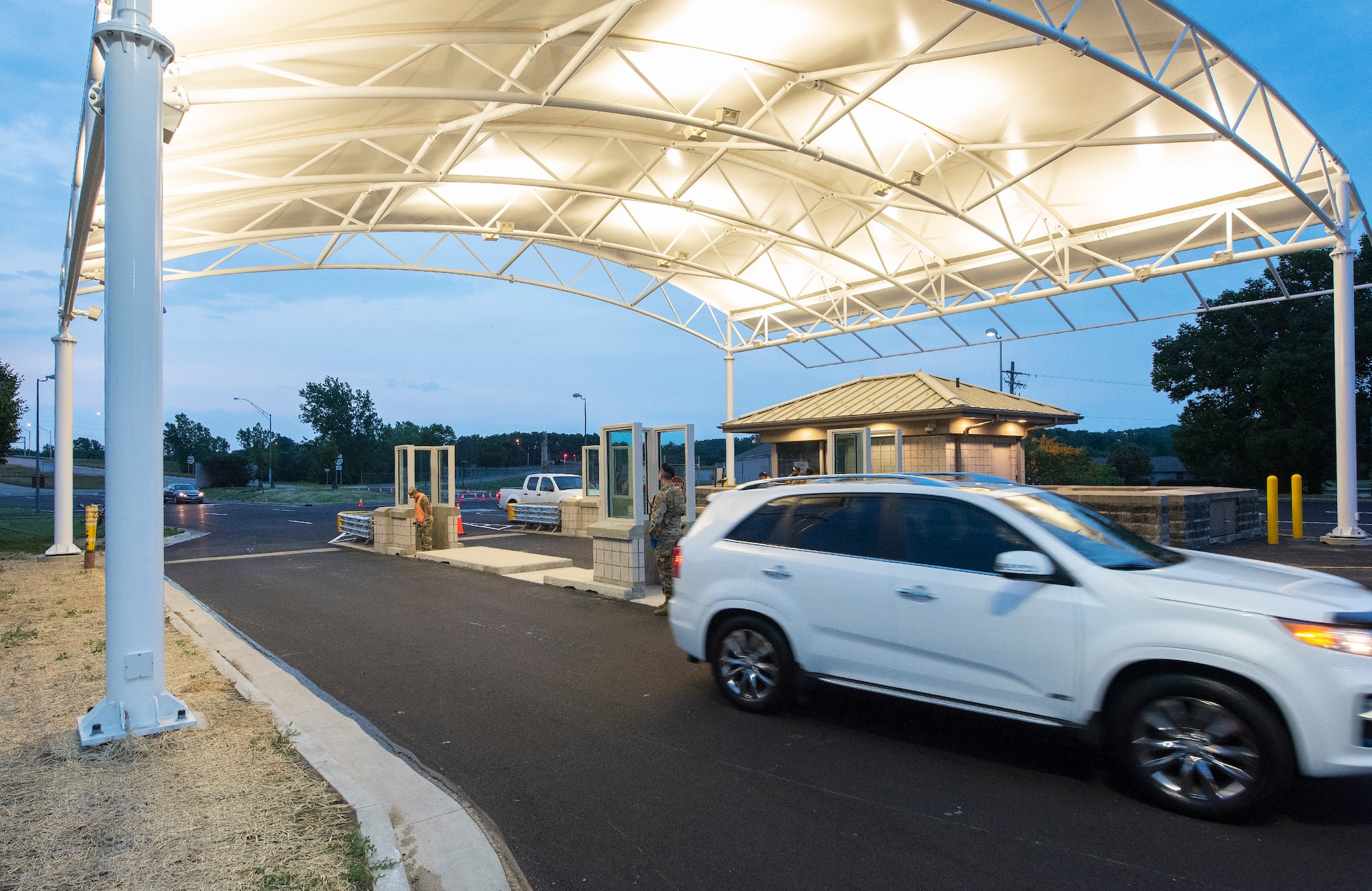 A vehicle passes through Wright-Patterson Air Force Base, Ohio, Gate 15A June 21, 2021. The car was one of the first vehicles to use the newly-reopened gate that had been closed for construction and an upgrade. (U.S. Air Force photo by R.J. Oriez)