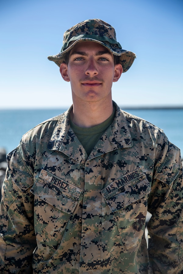U.S. Marine Cpl. Jordan Perez, a combat engineer with 7th Engineer Support Battalion, 1st Marine Logistics Group, poses for a photo in the 21 Area of Marine Corps Base Camp Pendleton, California, Feb. 19, 2021. Perez was awarded a challenge coin for saving a couple after their kayak flipped over in the 21 Area Boat Basin. Perez is a native of Antioch, California. (U.S. Marine Corps photo by Lance Cpl. Alison Dostie)