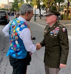 Lt. Gen. Douglas Gabram (right), Installation Management Command commanding general, shakes hands with San Antonio Mayor Ron Nirenberg during the Fiesta event June 17.