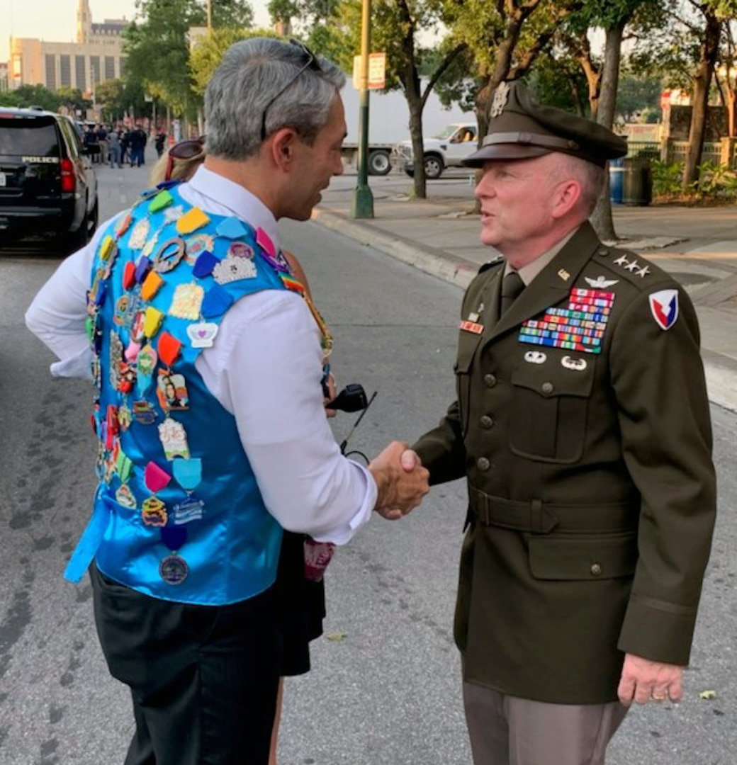 Lt. Gen. Douglas Gabram (right), Installation Management Command commanding general, shakes hands with San Antonio Mayor Ron Nirenberg during the Fiesta event June 17.