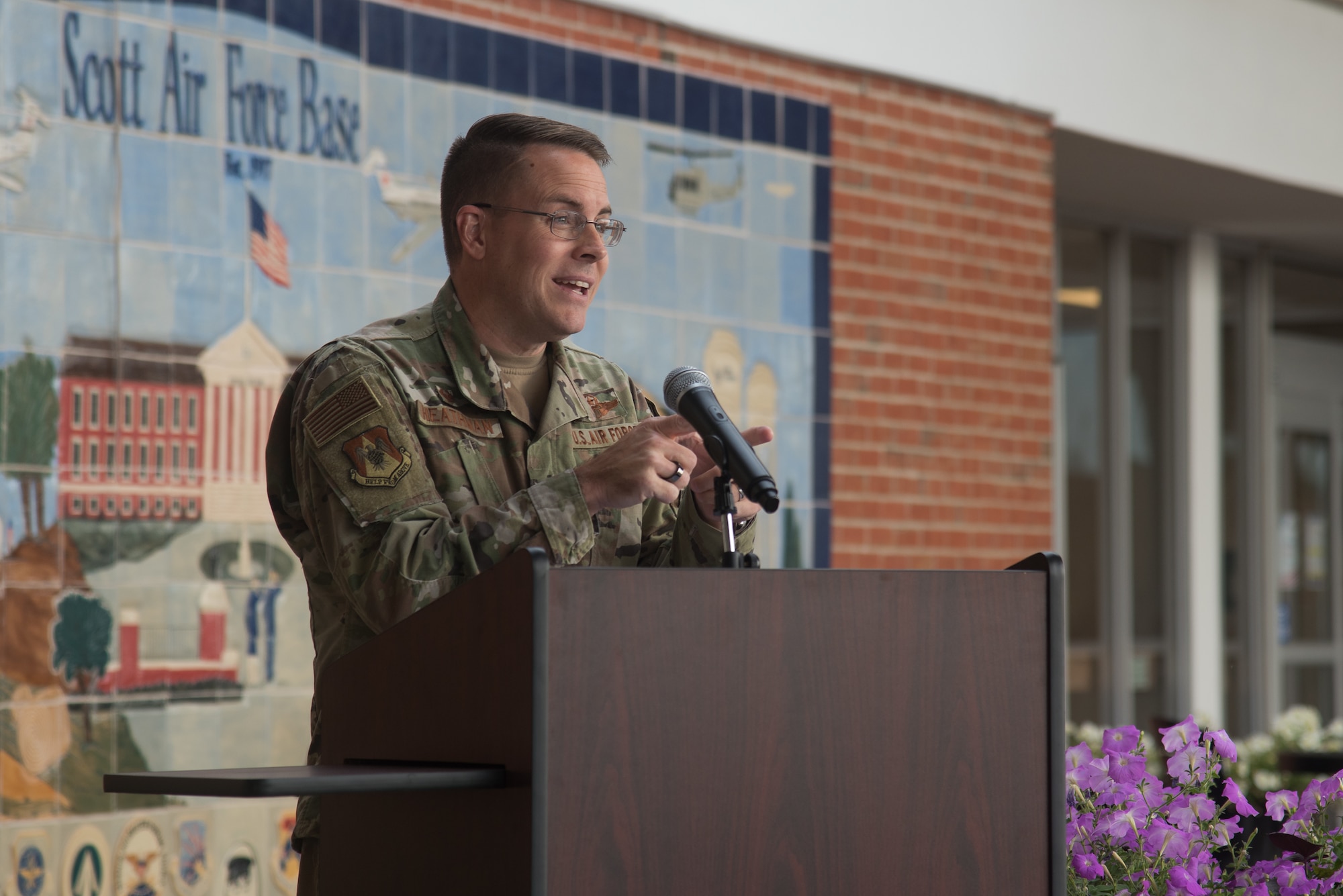 U.S. Air Force Col. J. Scot Heathman, 375th Air Mobility Wing commander, commemorates the opening of the Exceptional Family Member Program One Stop on Scott Air Force Base, Illinois, June 24, 2021. The One Stop program relocated the three components of EFMP into one building to maximize communication between families and the EFMP. (U.S. Air Force photo by Airman 1st Class Mark Sulaica)
