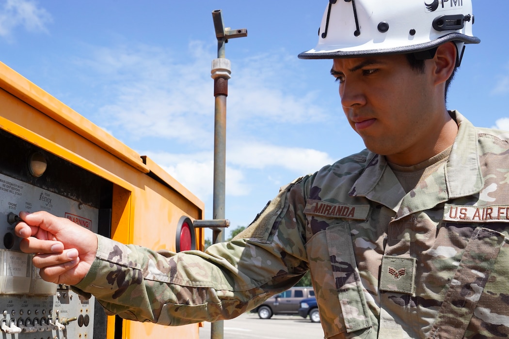 U.S. Air Force Senior Airman David Mirnada, 85th Engineering Installation cable and antenna installer, turns on a generator at Keesler Air Force Base, Mississippi, June 23, 2021. The 85th EIS is the only active duty command, control, communication-computer engineering and installation squadron in the Air Force. (U.S. Air Force photo by Senior Airman Spencer Tobler)