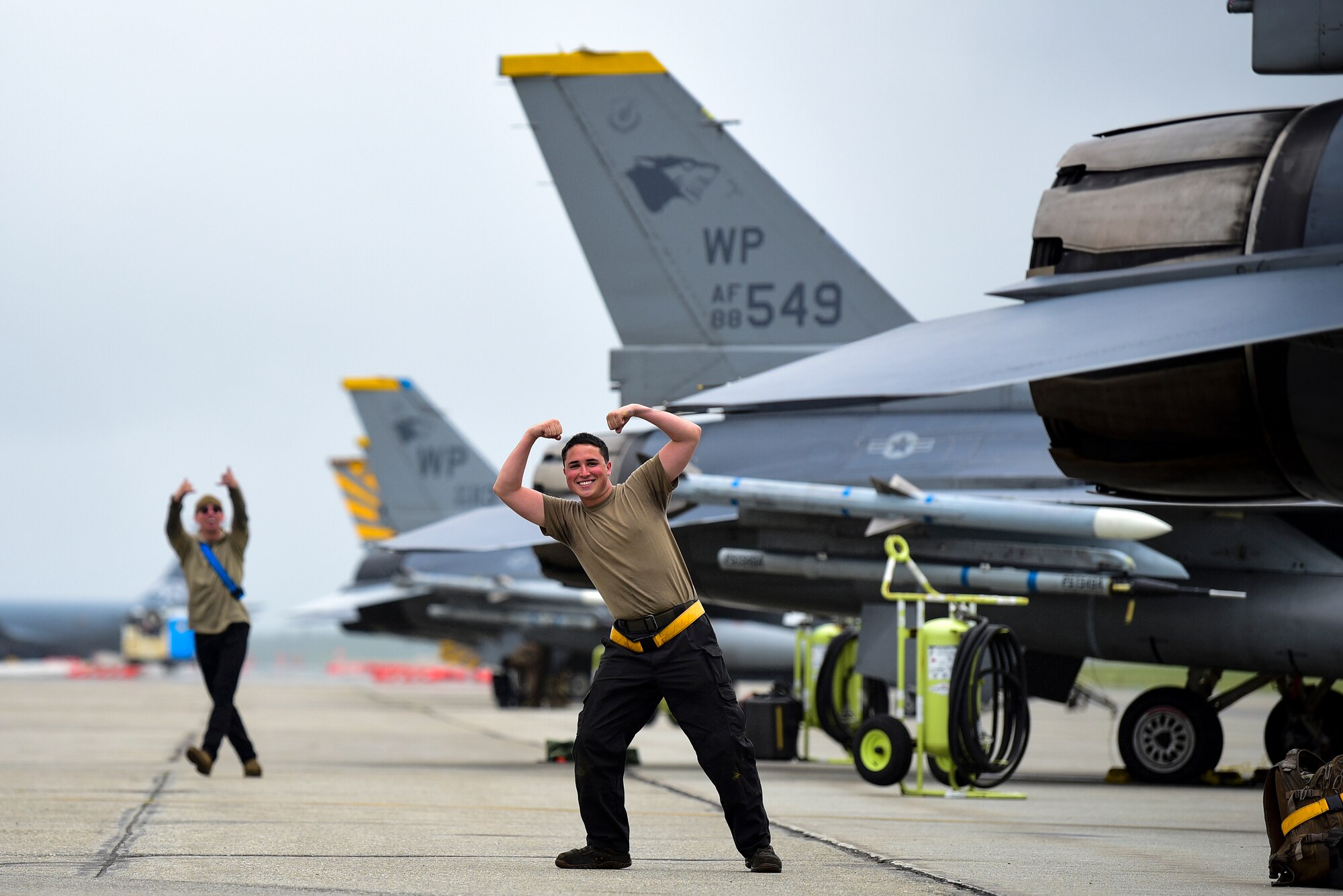 Airman 1st Class Matthew Wood, 8th Aircraft Maintenance Squadron crew chief, left, and Senior Airman Kodi Vigil, 80th Aircraft Maintenance Unit crew chief, pose for a photo during Red Flag-Alaska 21-2 at Eielson Air Force Base, Alaska, June 18, 2021. RF-A is a Pacific Air Forces-directed field training exercise designed to provide U.S. and allied forces realistic air combat training for which enhances joint and bilateral interoperability in the Indo-Pacific region. (U.S. Air Force photo by Senior Airman Suzie Plotnikov)
