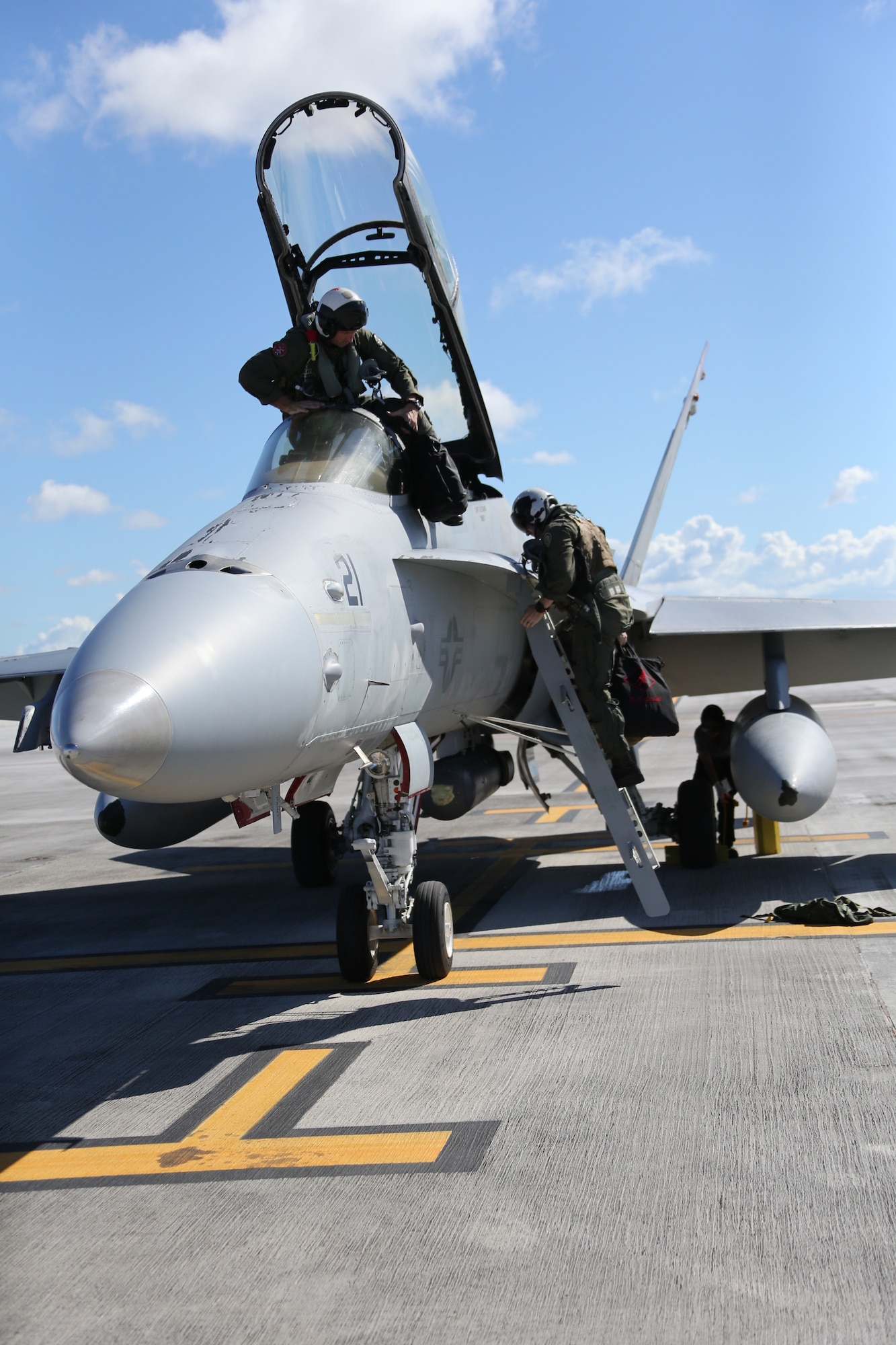 U.S. Marines Corps Lt. Col. Thomas Lee, left, and Maj. Dan Getchell with Marine Fighter Attack Squadron 232 arrive on Andersen Air Force Base, Guam to conduct training and participate in regional exercises, June 16, 2021. The training and exercises enable the squadron to increase operational readiness, improve interoperability and meet training requirements. Marine Corps Base Camp Blaz supports the squadron by providing them aviation hangars and spaces to perform maintenance and repair aircraft. MCB Camp Blaz continues to support units in the region by providing critical administrative and logistical support enabling them conduct training and maintain readiness. (U.S. Marine Corps Photo by Gunnery Sgt. John Ewald)