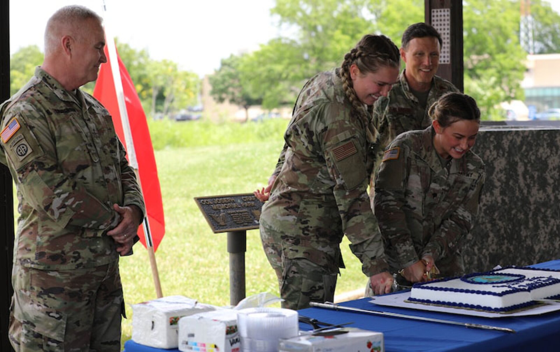 Per military tradition the two senior members of the Air Guard and Army Guard helped cut the cake with the two lowest ranking members in attendance of each branch