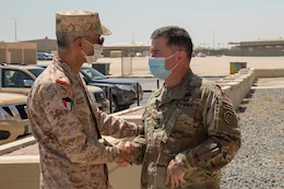 U.S. Army Maj. Gen. Douglas Crissman, U.S. Army Central deputy commanding general (right), welcomes Kuwait Maj. Gen. Waleed Al-Sardi, Kuwait Ministry of Defense Assistant Chief of Staff for Plans and Operations, to a bilateral engagement held June 20, 2021, at the Area Support Group – Kuwait Headquarters on Camp Arifjan, Kuwait. The event allowed key leaders to discuss current and future partnerships between the U.S. and Kuwait. (U.S. Army photo by Joseph Black)