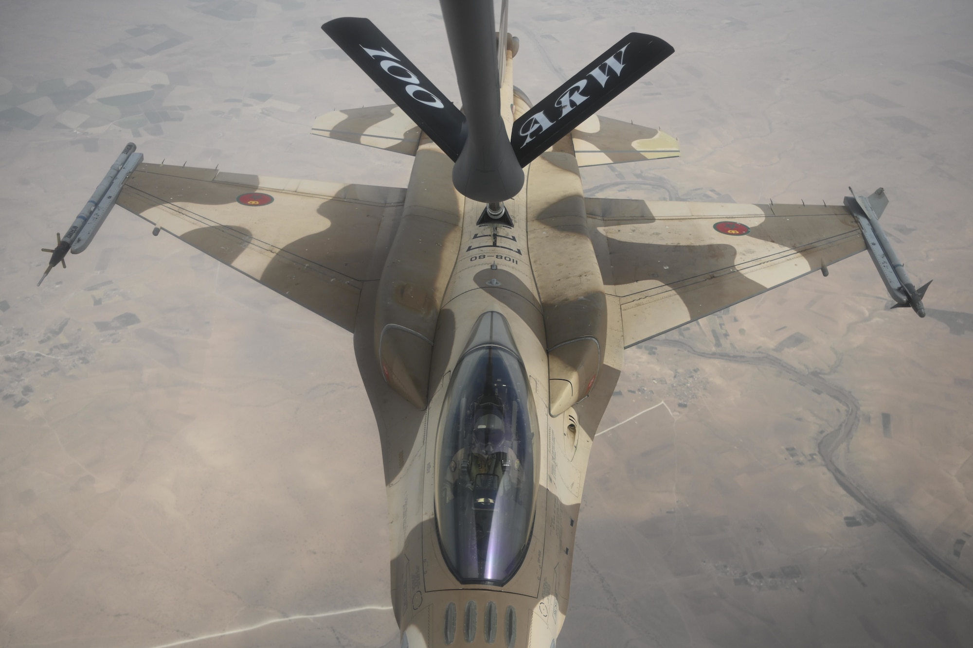 A Royal Moroccan Air Force F-16 Fighting Falcon refuels with a U.S. Air Force KC-135 Stratotanker over Morocco during exercise African Lion 2021, June 15, 2021. African Lion is U.S. Africa Command's largest, premier, joint, annual exercise hosted by Morocco, Tunisia and Senegal. More than 7,000 participants from nine nations and NATO train together with a focus on enhancing readiness for U.S. and partner nation forces. (U.S. Air Force photo by Senior Airman Joseph Barron)