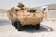 A Stryker armored combat vehicle circles around the Stryker battle damage repair facility at Camp As Sayliyah, Qatar, Oct. 5. The Stryker infantry carrier vehicle had been restored after deterioration during enemy engagement in Iraq.