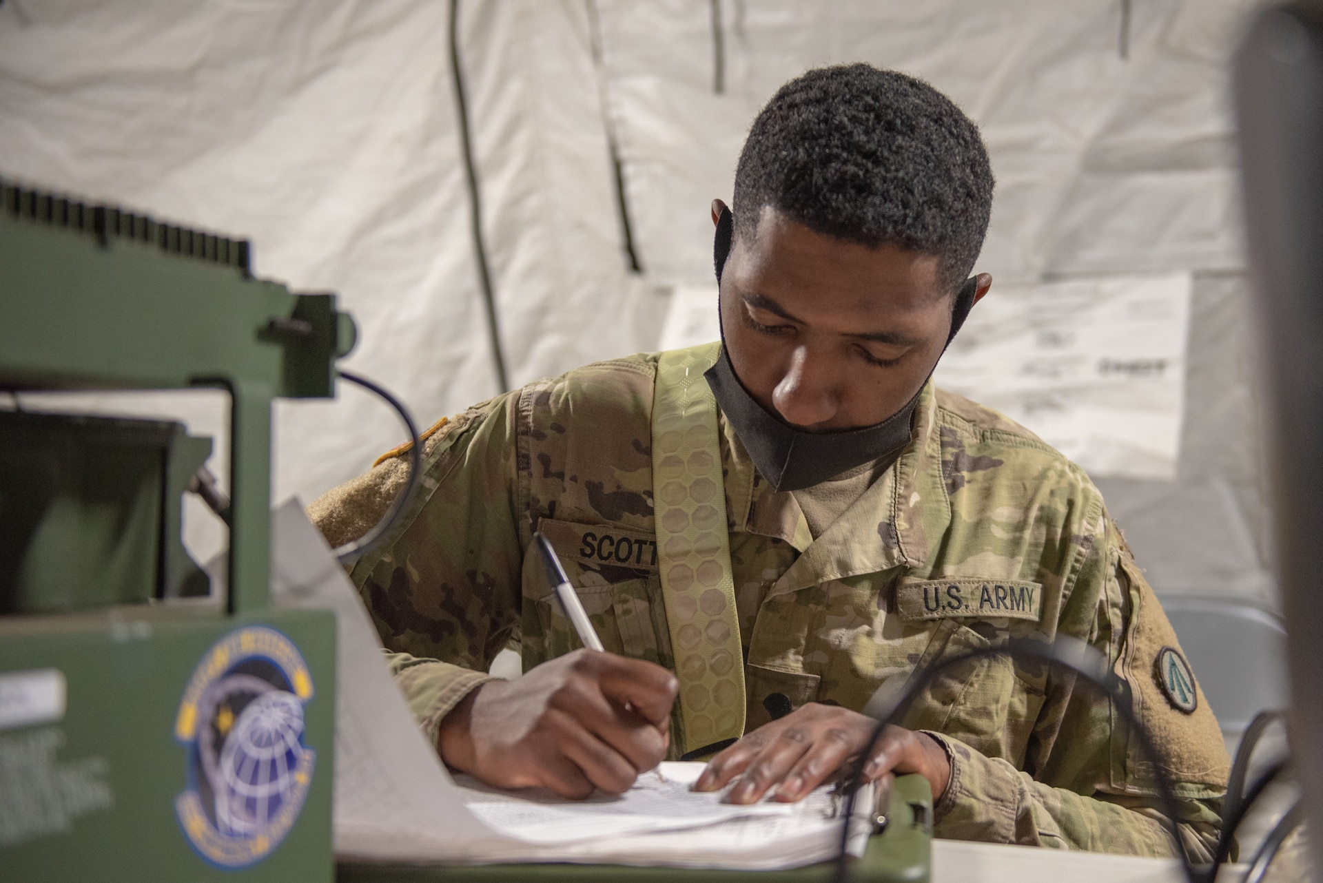 U.S. Army Spc. Jeremiah Scott, a transportation specialist with 690th Rapid Port Opening Element, tracks the movement of cargo during Operation Lone Oak at Volk Field, Wis., June 10, 2021. The RPOE worked in conjunction with the Kentucky Air National Guard’s 123rd Contingency Response Group to operate a Joint Task Force-Port Opening during the exercise. The objective of a JTF-PO is to establish a complete air logistics hub and surface distribution network. (U.S. Air National Guard photo by Senior Master Sgt. Vicky Spesard)