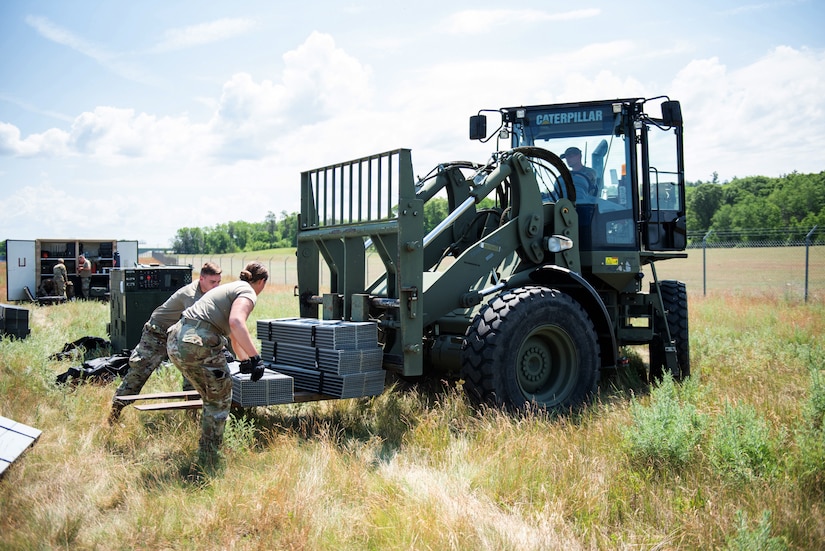 Airmen from the Kentucky Air National Guard’s 123rd Contingency Response Group set up their base of operations for a Joint Task Force-Port Opening exercise known as Operation Lone Oak on June 7, 2021, at Volk Field, Wis. The objective of a JTF-PO is to establish a complete air logistics hub and surface distribution network from scratch. (U.S. Air National Guard photo by Senior Master Sgt. Vicky Spesard)