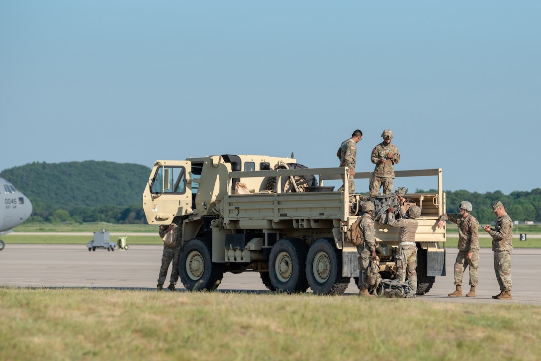 Soldiers assigned to the U.S. Army’s 690th Rapid Port Opening Element from Ft. Eustis, Va., combine efforts with Airmen from the Kentucky Air National Guard’s 123rd Contingency Response Group to establish a Joint Task Force-Port Opening during Operation Lone Oak at Volk Field, Wis., June 11, 2021. More than 50 RPOE soldiers supported the JTF-PO to establish a complete air logistics hub and surface distribution network. (U.S. Air National Guard photo by Senior Master Sgt. Vicky Spesard)