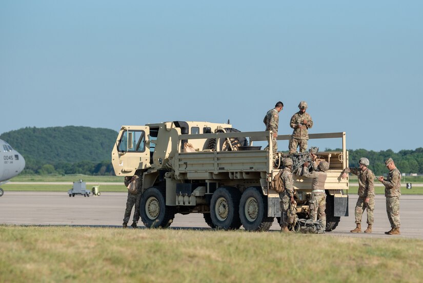 Soldiers assigned to the U.S. Army’s 690th Rapid Port Opening Element from Ft. Eustis, Va., combine efforts with Airmen from the Kentucky Air National Guard’s 123rd Contingency Response Group to establish a Joint Task Force-Port Opening during Operation Lone Oak at Volk Field, Wis., June 11, 2021. More than 50 RPOE soldiers supported the JTF-PO to establish a complete air logistics hub and surface distribution network. (U.S. Air National Guard photo by Senior Master Sgt. Vicky Spesard)