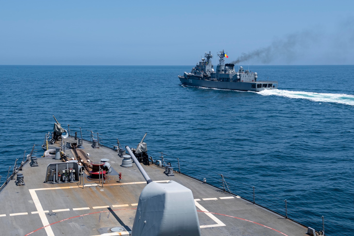 The Romanian Navy frigate ROS Marasesti (F 111), right, sails in formation with the Arleigh Burke-class guided-missile destroyer USS Laboon (DDG 58) during a passing and communication exercise in the Black Sea, June 23, 2021.