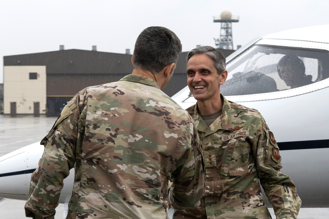 U.S. Air Force Col. William McKibban, 52nd Fighter Wing vice commander, greets U.S. Air Force Lt. Gen. Steven Basham, U.S. Air Forces in Europe and Air Forces Africa deputy commander.