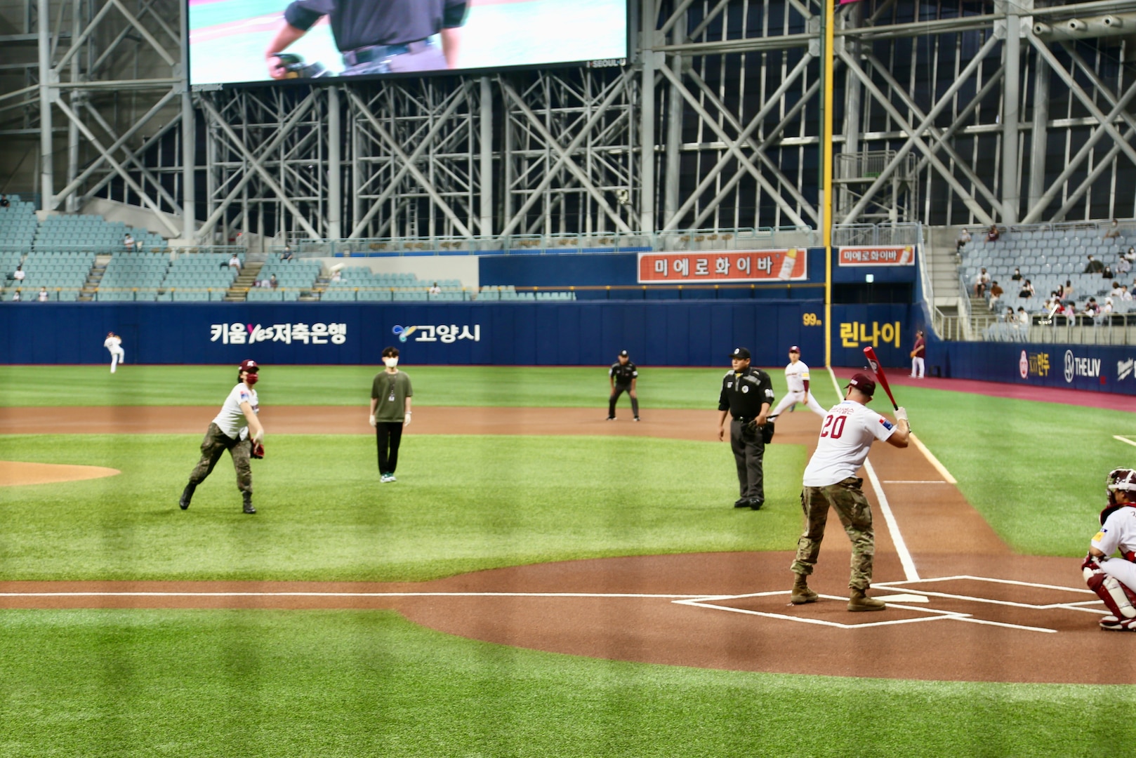 U.S. Army Capt. Miles Garbielson and ROK Army Capt. Ha Neul prepare for their participation in the ceremonial first pitch before South Korea's professional baseball game between the Kiwoom Heroes and the Kia Tigers at Gecheok Sky Dome on June 25, 2021.