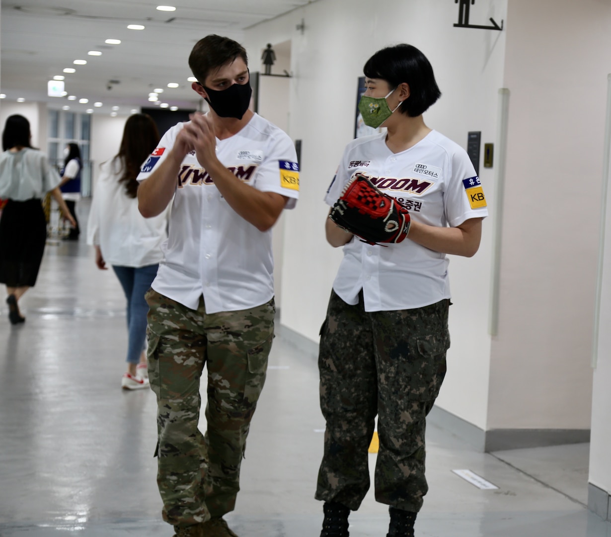 U.S. Army Capt. Miles Garbielson and ROK Army Capt. Ha Neul prepare for their participation in the ceremonial first pitch before South Korea's professional baseball game between the Kiwoom Heroes and the Kia Tigers at Gecheok Sky Dome on June 25, 2021.